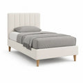 Lit simple rembourré en tissu ivoire 90 × 190 cm avec tête de lit à panneaux verticaux et pieds en bois